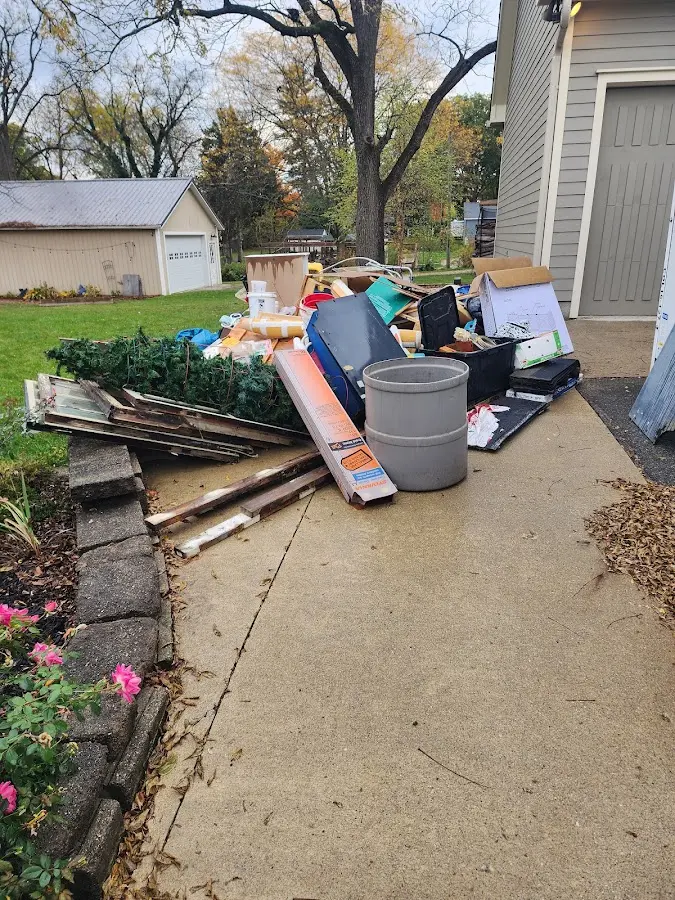 Dumpster being loaded with debris for Residential Dumpster Rental in Ashburn